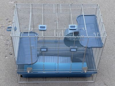 Hamster/Small Animal Cage with Blue Platforms, Water Dispenser, Wheel, and Tunnels.