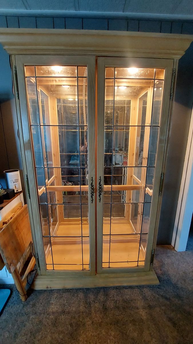 Huge Glass lighted Cabinet Dimensions are 78 in tall 17 in deep 44 wide.