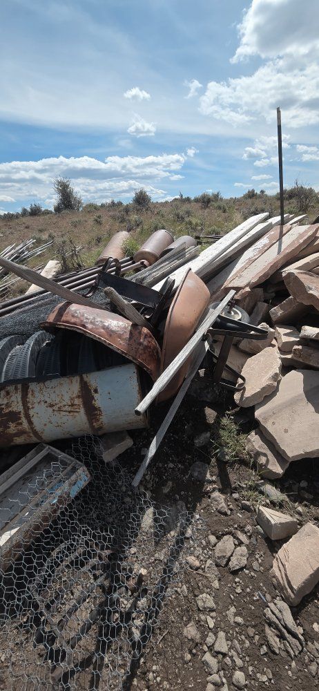Assorted Scrap Metal, Wheelbarrow Tubs, and Landscaping Stone Pile
