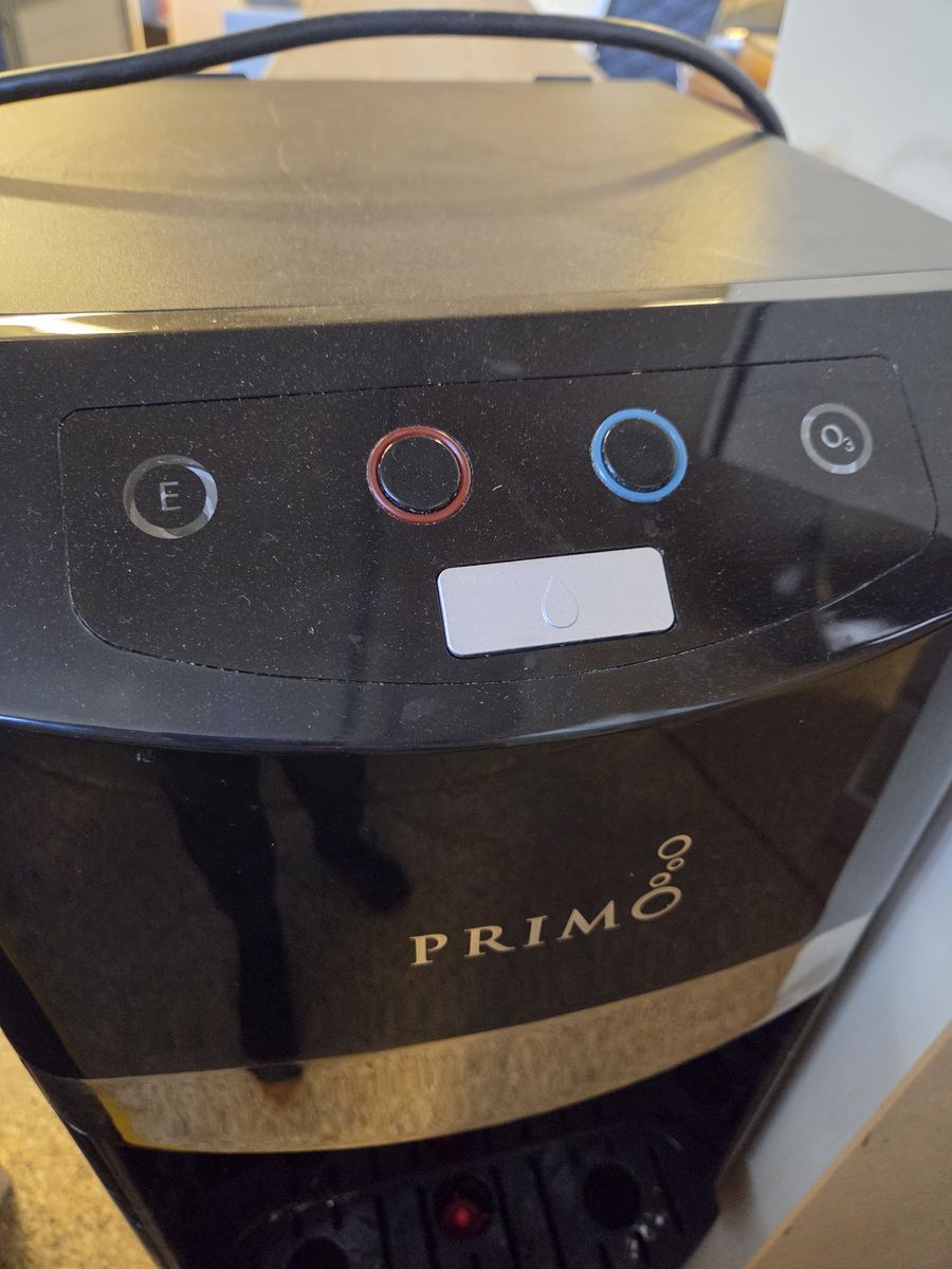Primo water dispenser and 7 water jugs