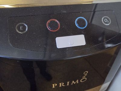 Primo water dispenser and 7 water jugs