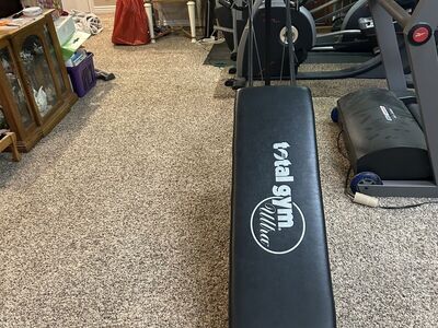 Total Gym, has very little use and is in good condition.
