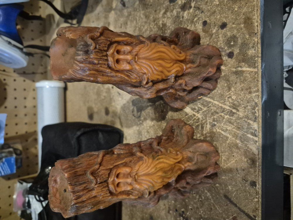 Two decorative tree people candles