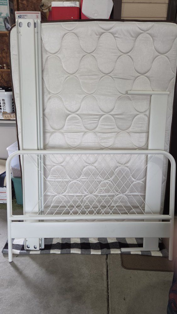 Full size bed frame and mattress.