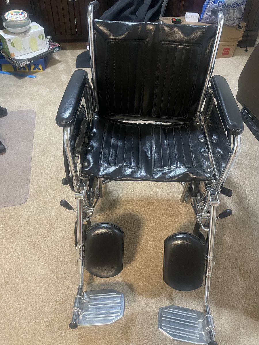 Standard Manual Wheelchair - Black Vinyl, Chrome Frame - Lightweight & Foldable for Transport. 20 inch seat.