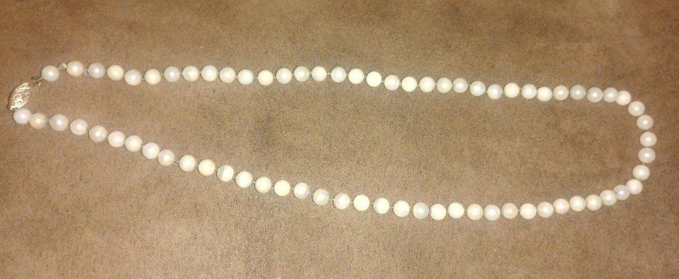18k gold Aroya Pearl necklace from Hawaii with a 20" length.