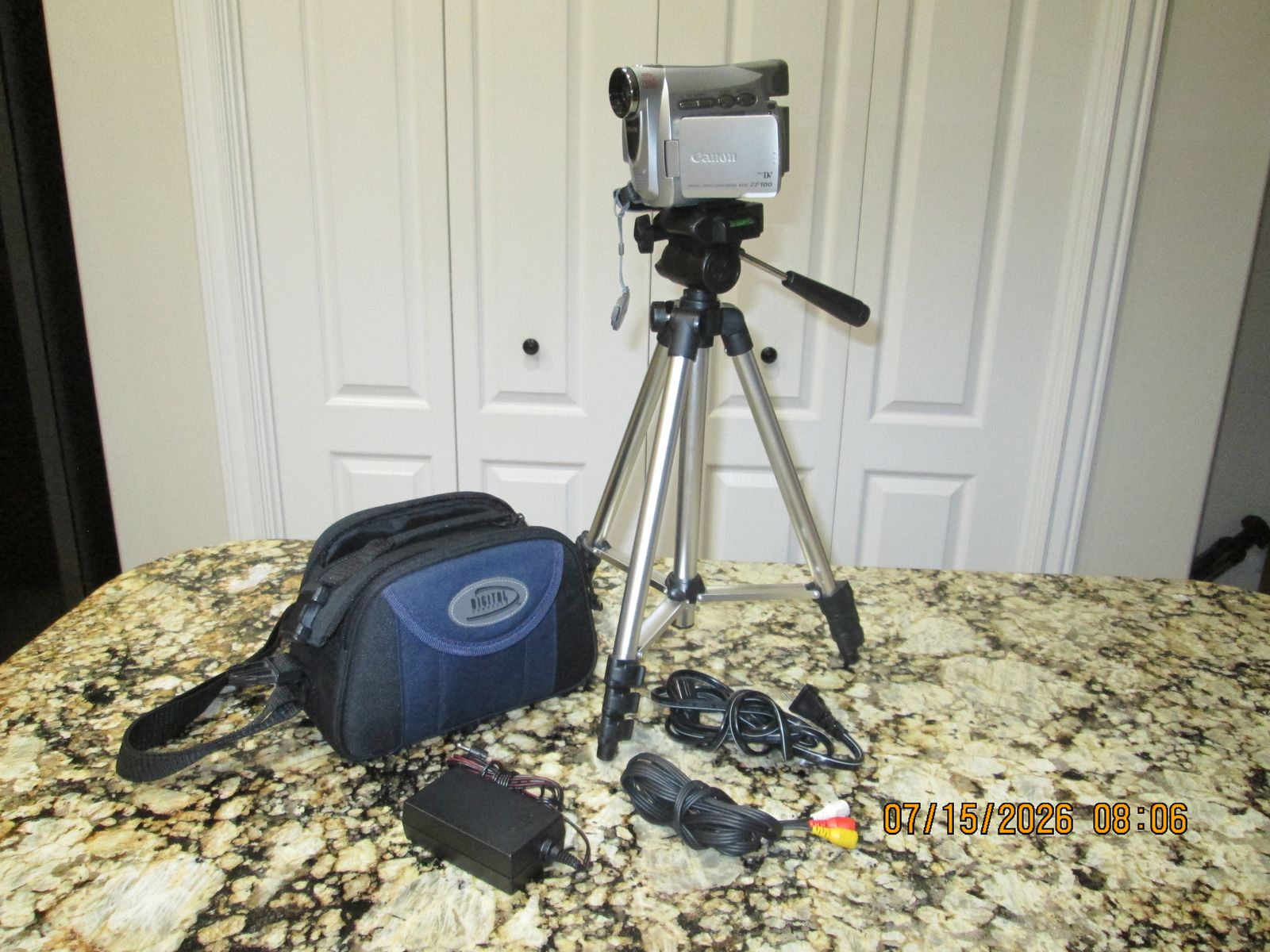 Canon ZR100 Mini DV Digital Camcorder with Tripod & Bag - 20x Zoom