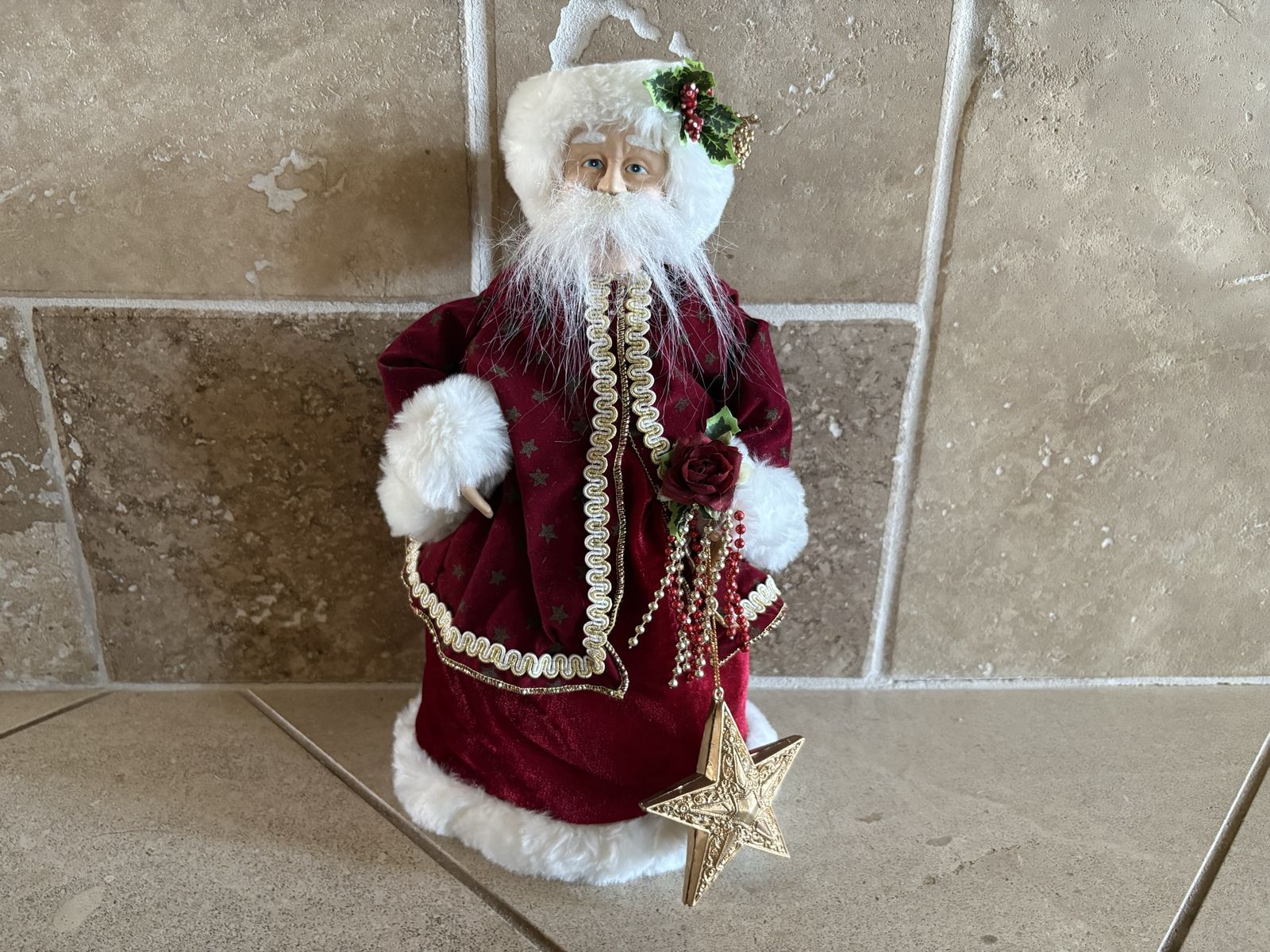 Santa Claus in Red Velvet Holding Gold Star
