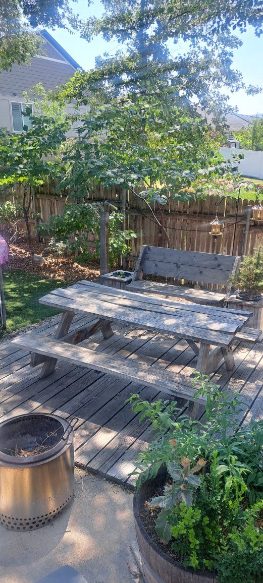 Weathered Wooden Picnic Table with Attached Benches