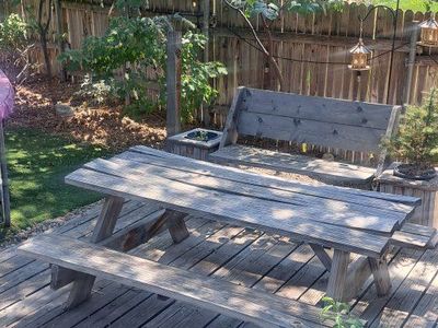 Weathered Wooden Picnic Table with Attached Benches