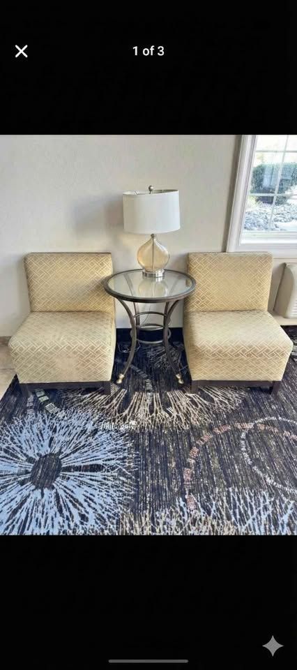 Two seats with table and lamp