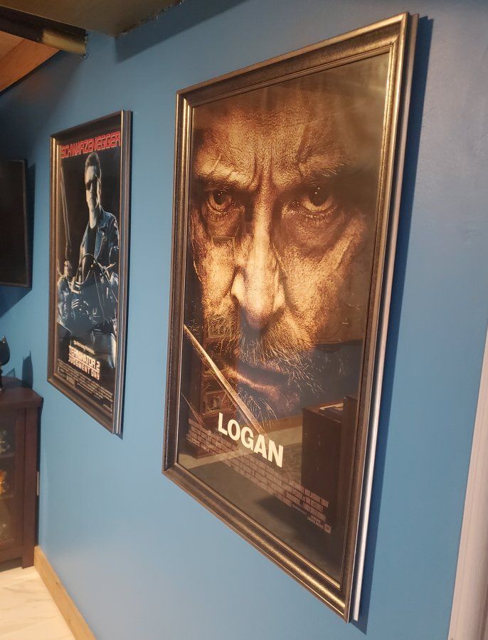 Framed T2 and Logan posters