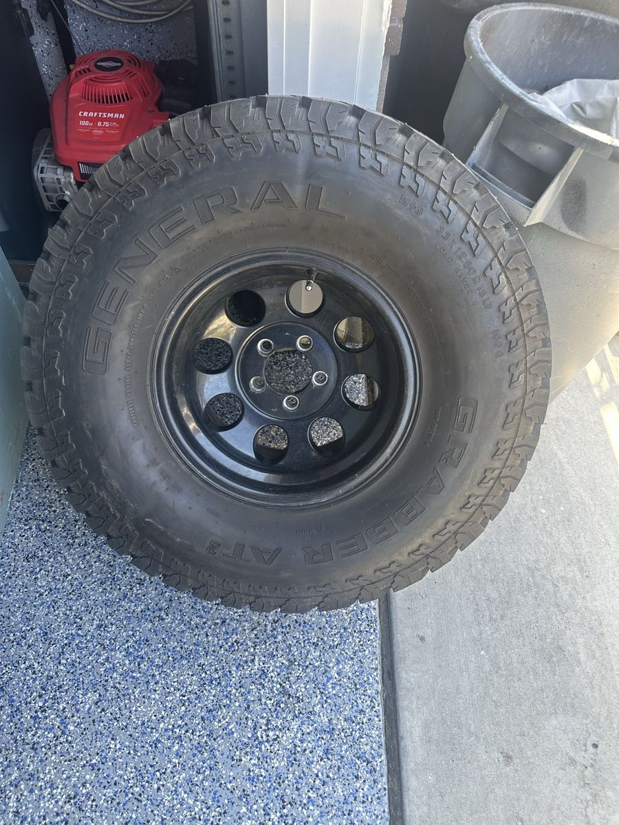 General Grabber AT2 33x12.50R15LT Tire on Black Steel Wheel