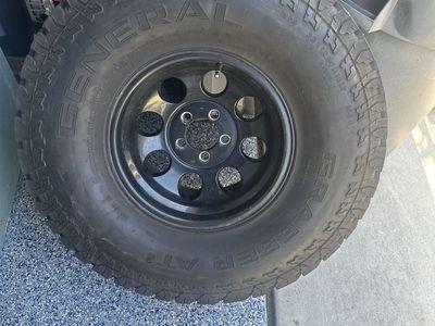 General Grabber AT2 33x12.50R15LT Tire on Black Steel Wheel