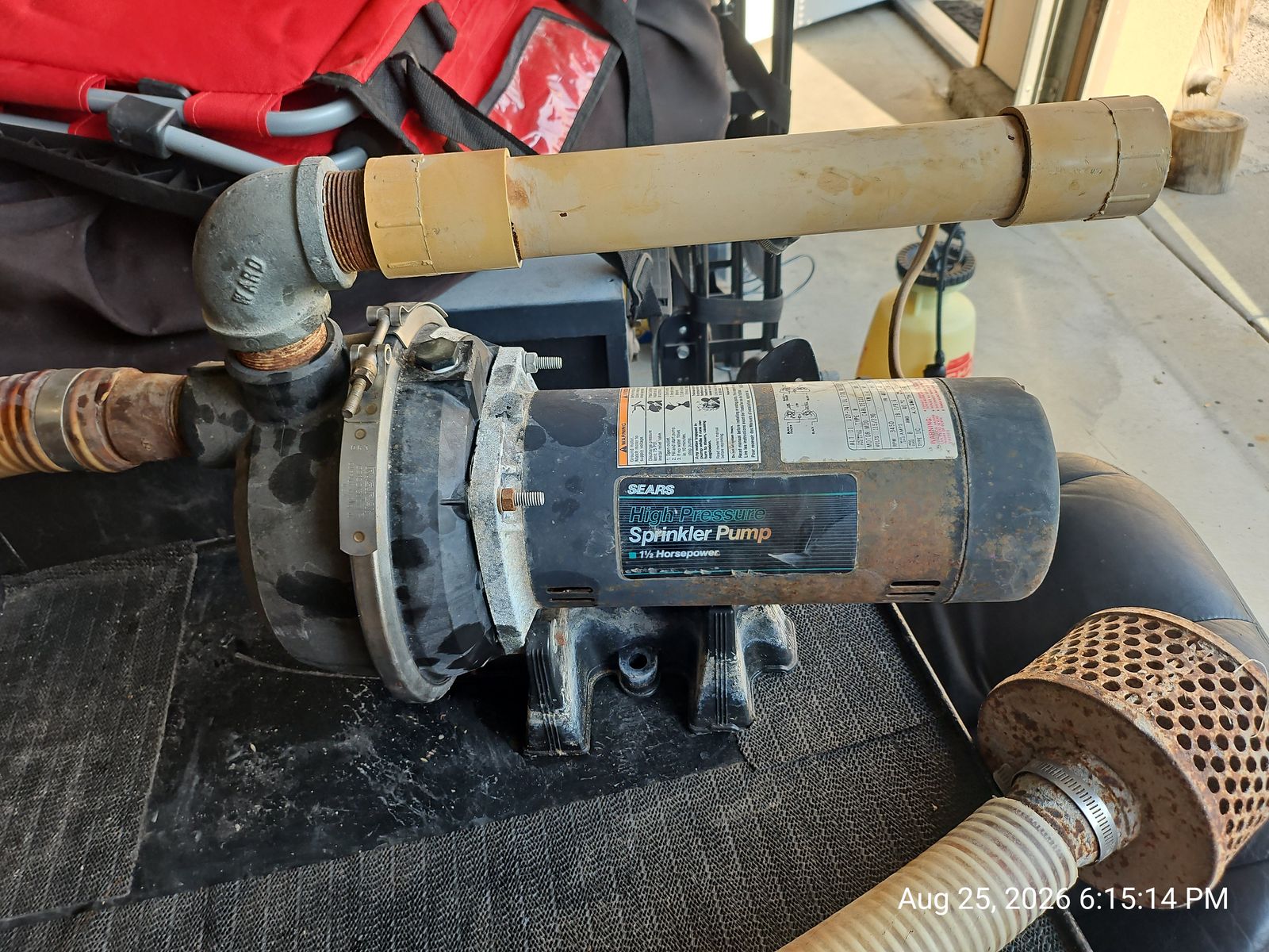Sears 1.5 HP high-pressure sprinkler pump with connected PVC suction line