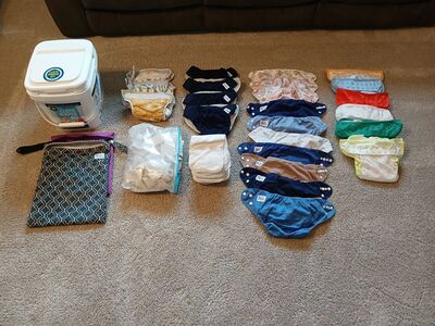23 gently used cloth diapers plus liners, bucket, storage bags, smoke & pet free