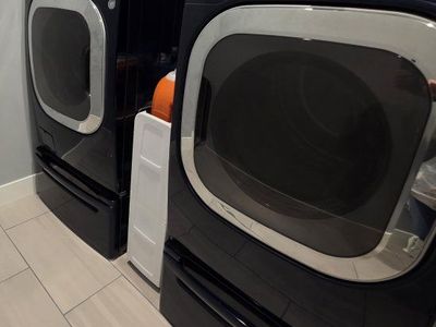 LG Front Load Washer and Electric Dryer with pedestals