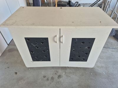 Black And White Cabinet With Cut Out Doors