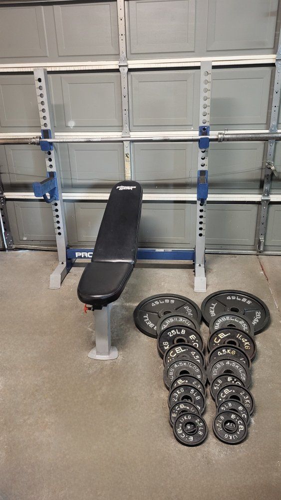 Bench and 260 pounds of weights