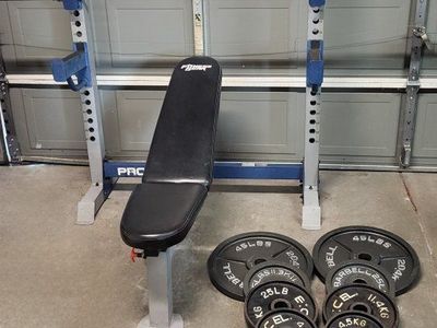 Bench and 260 pounds of weights