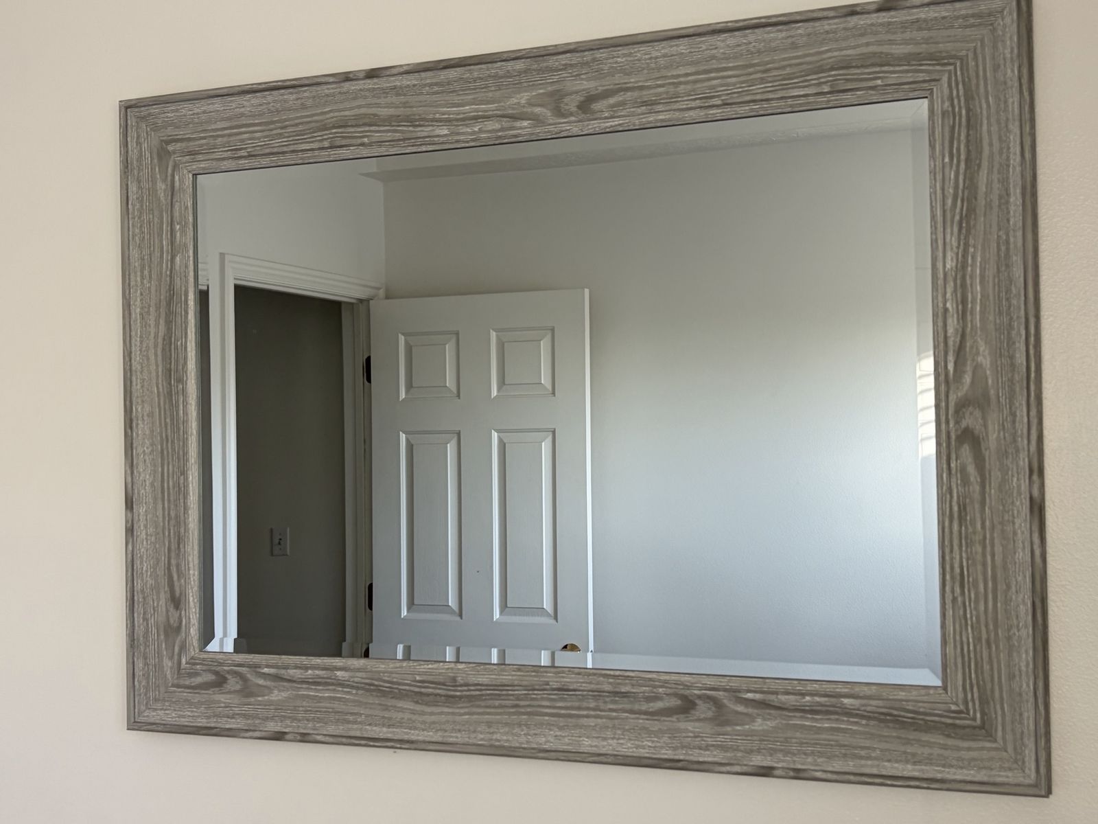 Large gray framed mirror