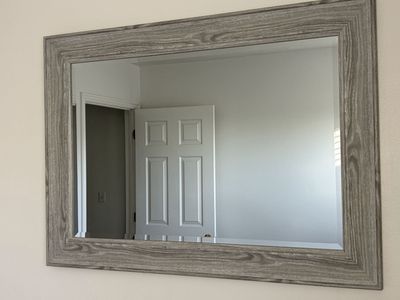 Large gray framed mirror