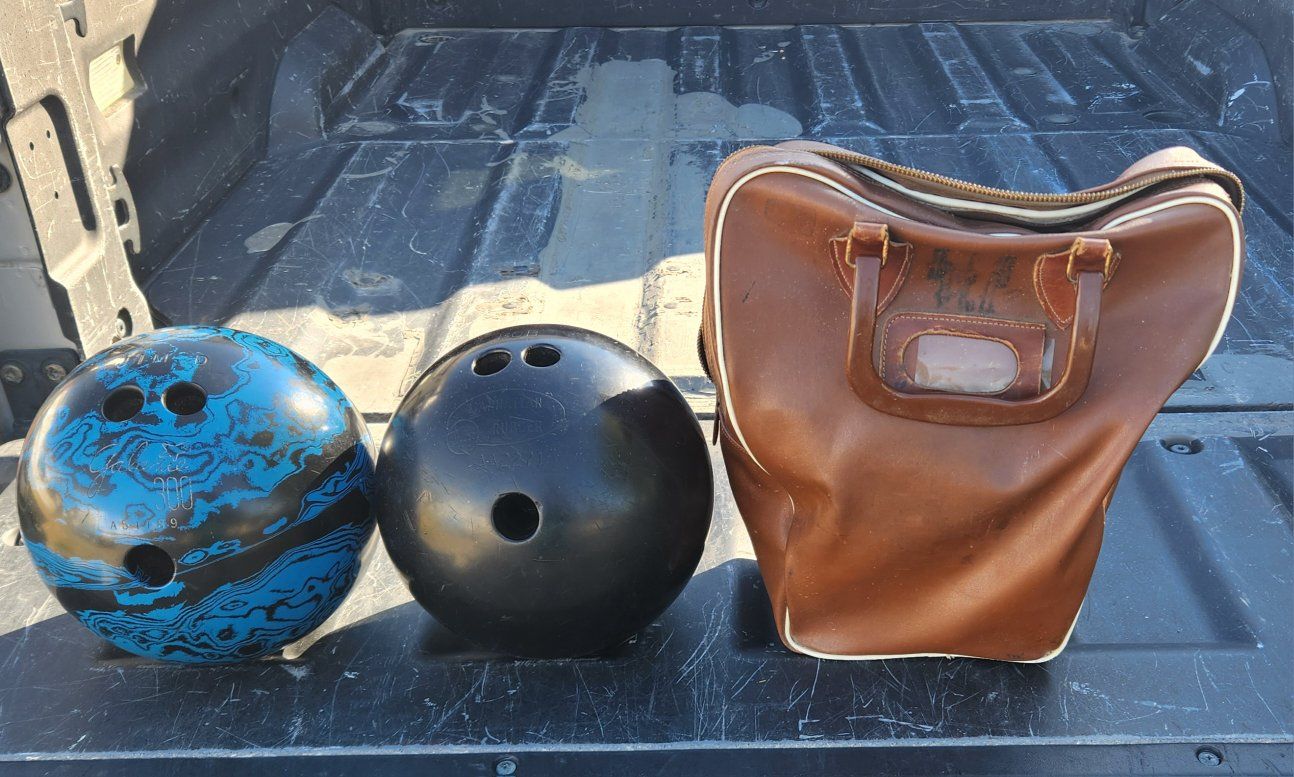 2 old spare bowling ball can be used for a craft or something