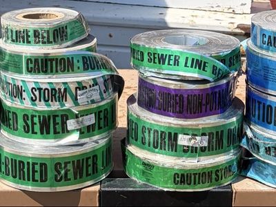 Buried waterline/sewer caution, tape