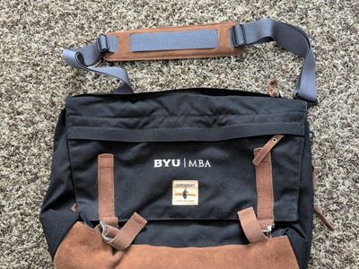 Cotopaxi Kpong 15L Satchel in black canvas with brown suede trim with BYU insignia