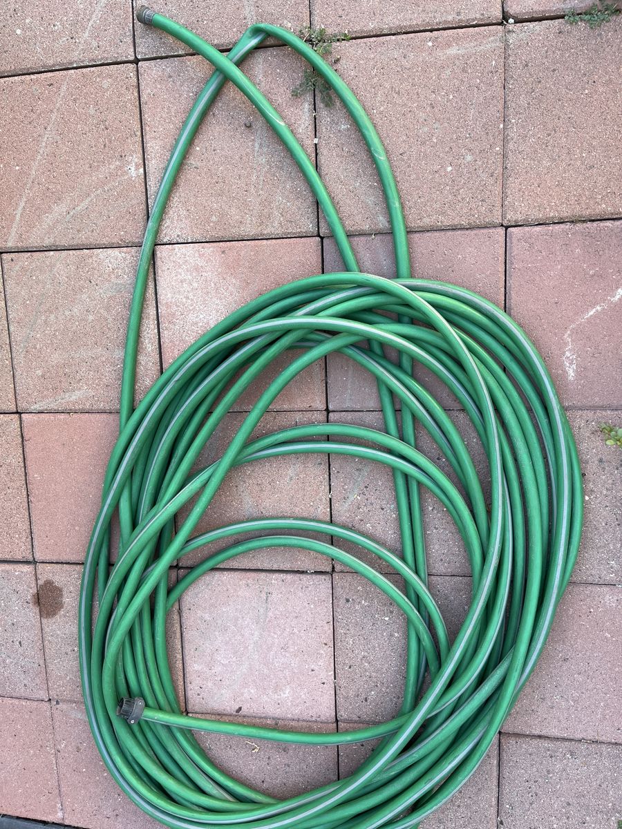 Green 100’ Outdoor Garden Water Hose.