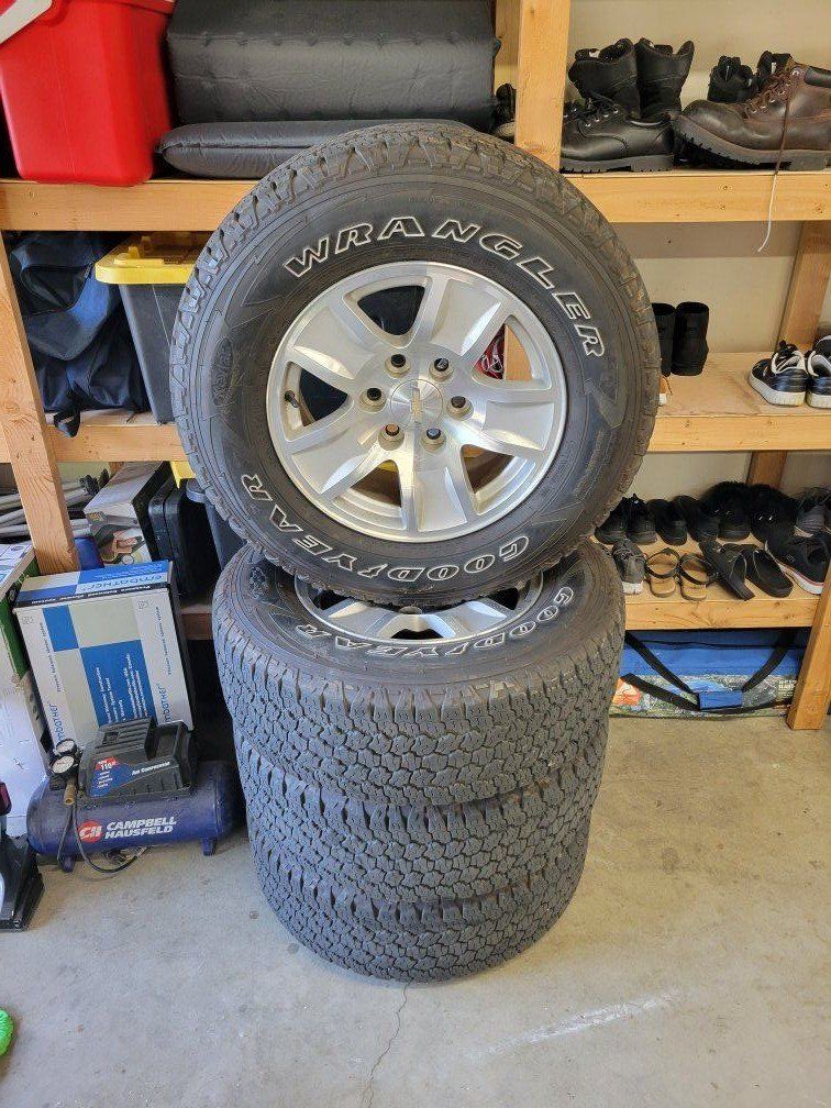 SET OF CHEVY RIMS AND GOODYEAR TIRES