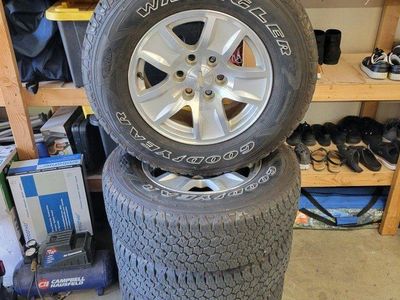 SET OF CHEVY RIMS AND GOODYEAR TIRES