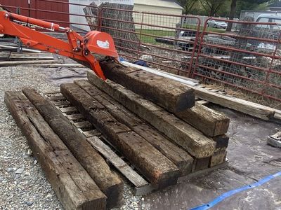 Railroad Ties for sale. I have TRACTOR with Backhoe to assist loading! Only $ 20.00 each.