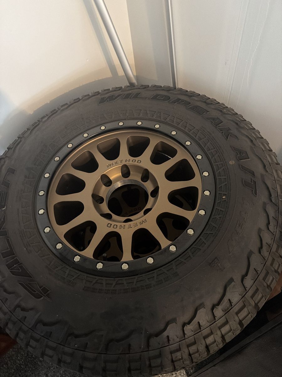 Set of 4 Falken Wildpeak A/T LT285/75R18 Tires with Method Race Wheels