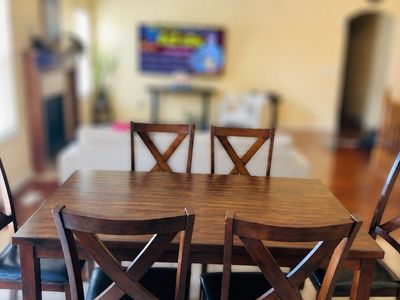 Wooden Dining Table with 6 Chairs - Dark Wood Finish, X-Back Design, Leatherette Seats