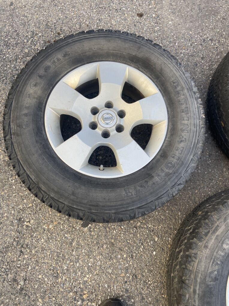 (4) Firestone Destination 245/70R16 Tires with Nissan Rims