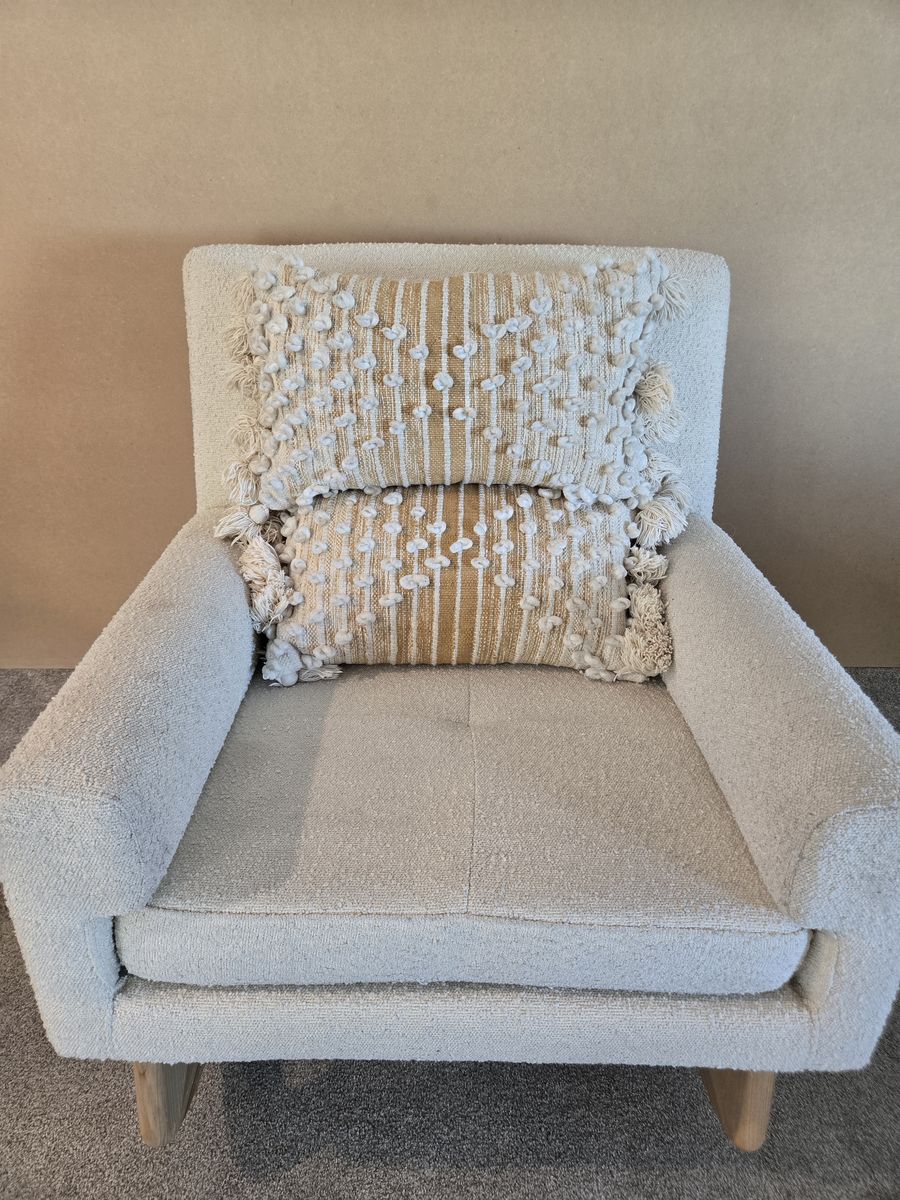 Two Magnolia Home Boho Chic lumbar pillows; yellow and white, textured