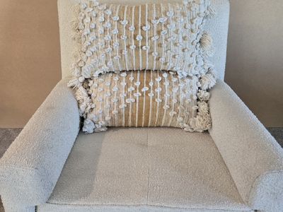 Two Magnolia Home Boho Chic lumbar pillows; yellow and white, textured