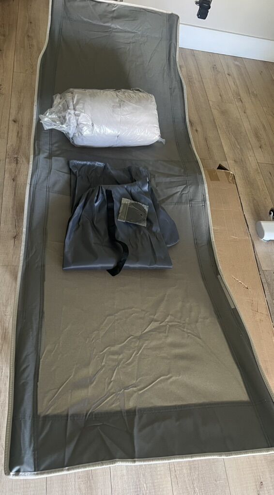 Folding camping cot with mat