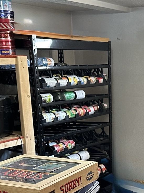 Two Black Shelf Reliance can rotation storage racks