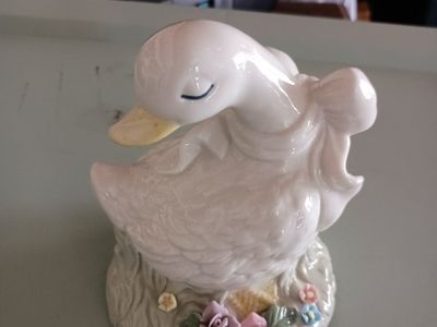 Vintage Ceramic Duck Figurine with Floral Base and Ribbon Accent