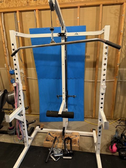 Squat rack, pulldown machine.