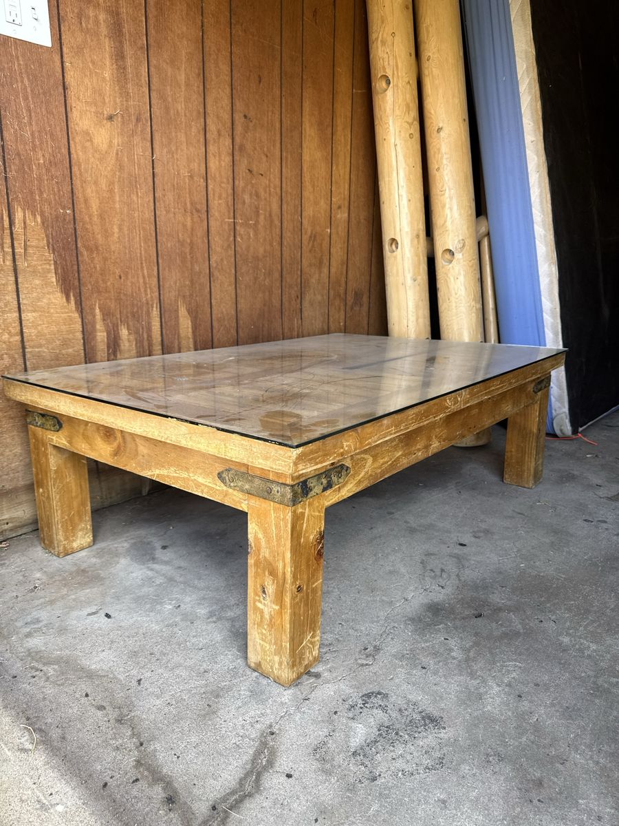 Rustic Wooden Coffee Table with Glass Top and Metal Corner Brackets