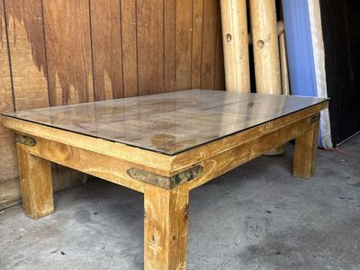 Rustic Wooden Coffee Table with Glass Top and Metal Corner Brackets