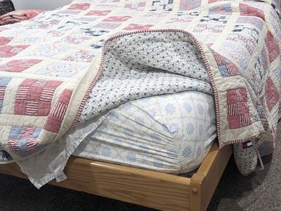 solid wood full size bed and purple mattress