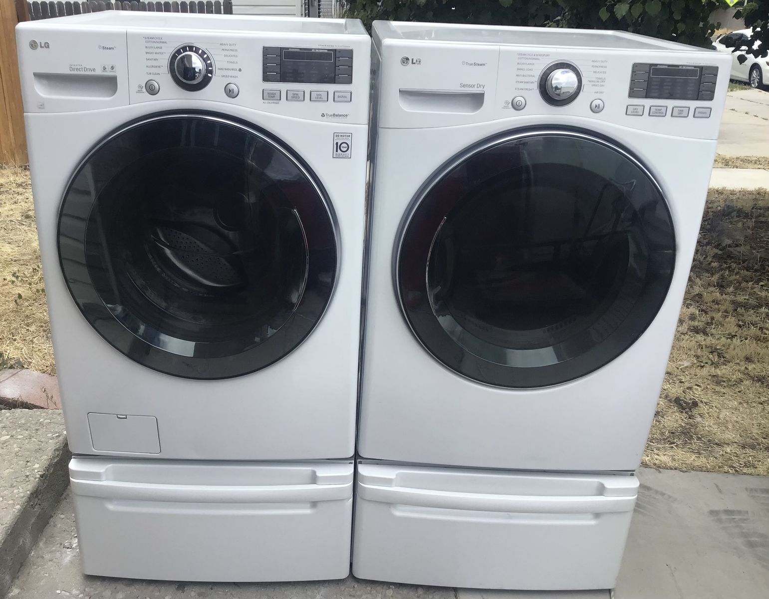 Beautiful LG White Front Load  Turbo Wash Washer & Electric Dryer Set with Steam & Pedestals. Includes free delivery