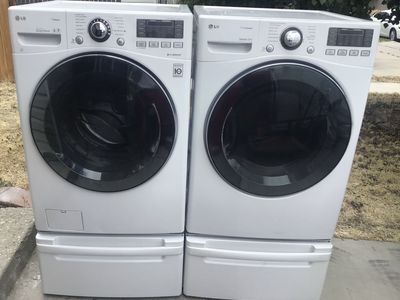 Beautiful LG White Front Load Turbo Wash Washer & Electric Dryer Set with Steam & Pedestals. Includes free delivery