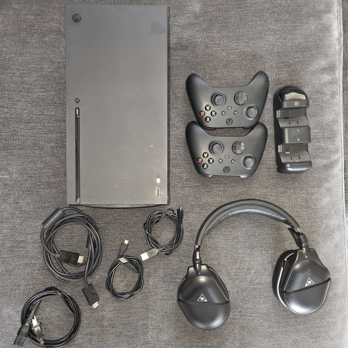 Xbox series X with controllers and headset