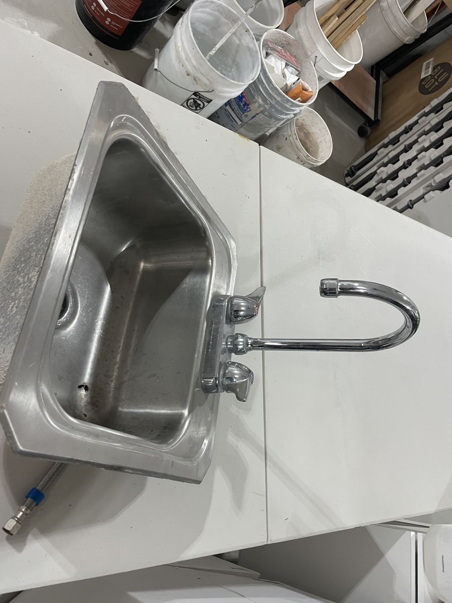 Stainless steel sink with faucet