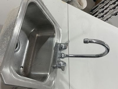 Stainless steel sink with faucet